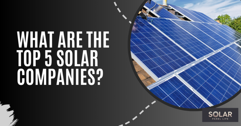 A close-up of solar panels on a rooftop with clear sky above.